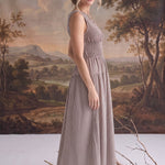graced The Harper brown gingham midi dress with a smocked bodice worn by a model in a studio setting