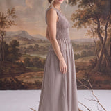 graced The Harper brown gingham midi dress with a smocked bodice worn by a model in a studio setting