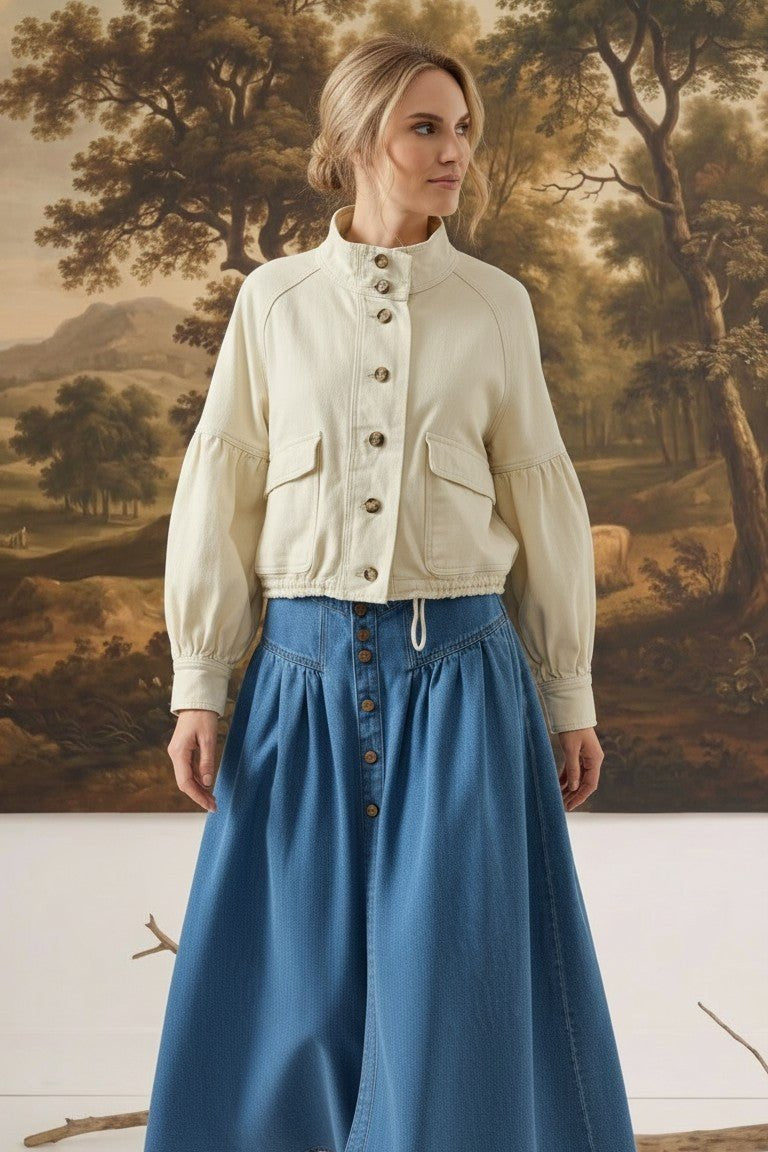 graced cream cotton blend jacket with balloon sleeves and button front worn by a model with a blue denim skirt