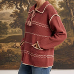 graced Jenna Whipstitch Sweater in dusty rose with contrast cream embroidery, collar, and front pockets on a model