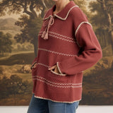 graced Jenna Whipstitch Sweater in dusty rose with contrast cream embroidery, collar, and front pockets on a model