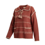 graced Jenna Whipstitch Sweater in rust red with cream contrast embroidery, collar, tassel tie, and front pockets.