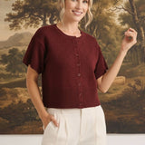 graced Jocelyn button up knit top in deep burgundy with a round neckline and short sleeves on a smiling model