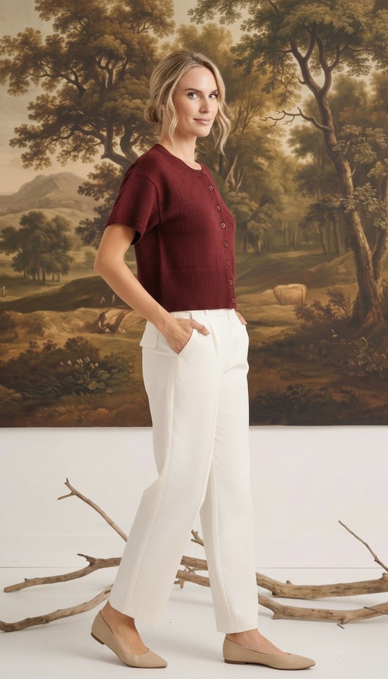 graced Jocelyn button up knit top in burgundy with short sleeves and a round neck, worn with white trousers