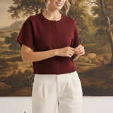 graced Jocelyn button up pointelle knit top in burgundy with short sleeves and round neckline worn by a model