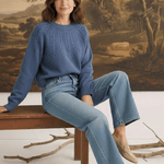 graced Kaitlyn sailor sweater in denim blue with round neckline and knit details worn by a model with jeans