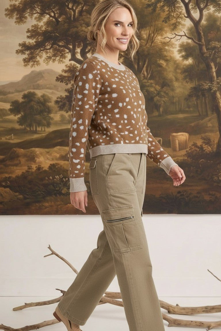 graced Kathy sweater in brown with white deer pattern, cotton-blend knit worn by a model with khaki cargo pants