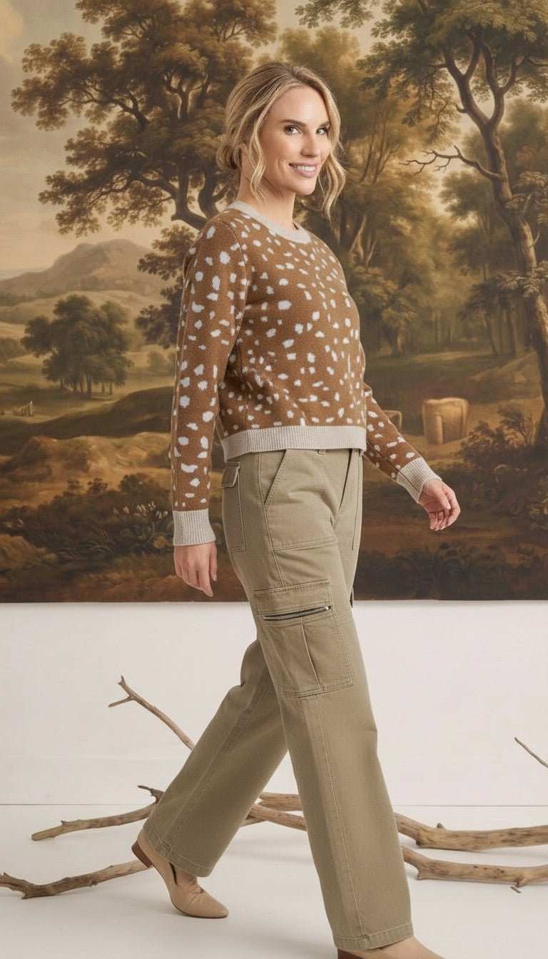 graced Kathy sweater in brown with white deer pattern, cotton-blend knit worn by a model with khaki cargo pants