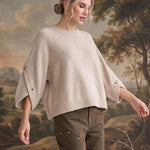 graced The Layla taupe knit top with button-detailed three-quarter sleeves worn by a model in a relaxed fit