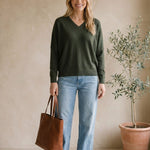 Dark olive Lyn super soft batwing V-neck sweater by graced, featuring a relaxed fit and cozy knit fabric.