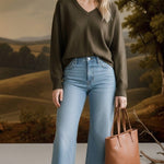 graced Lyn espresso brown V-neck batwing sweater worn by a smiling woman with light blue jeans and a tan tote bag