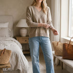Taupe batwing V-neck sweater by graced, showcasing a super soft, relaxed fit with wide sleeves and a cozy knit texture.