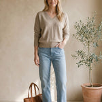 Taupe Graced Lyn super soft batwing V-neck sweater displayed on a model, showcasing its relaxed fit and cozy fabric.