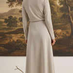 graced Margo midi skirt in beige wool blend worn by a woman with blonde hair in a bun, back view