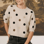 graced Michelle knit top in beige with multi-color polka dots, short sleeves, and a relaxed fit on a blonde model