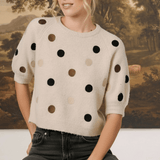 graced Michelle knit top in beige with multi-color polka dots, short sleeves, and a relaxed fit on a blonde model