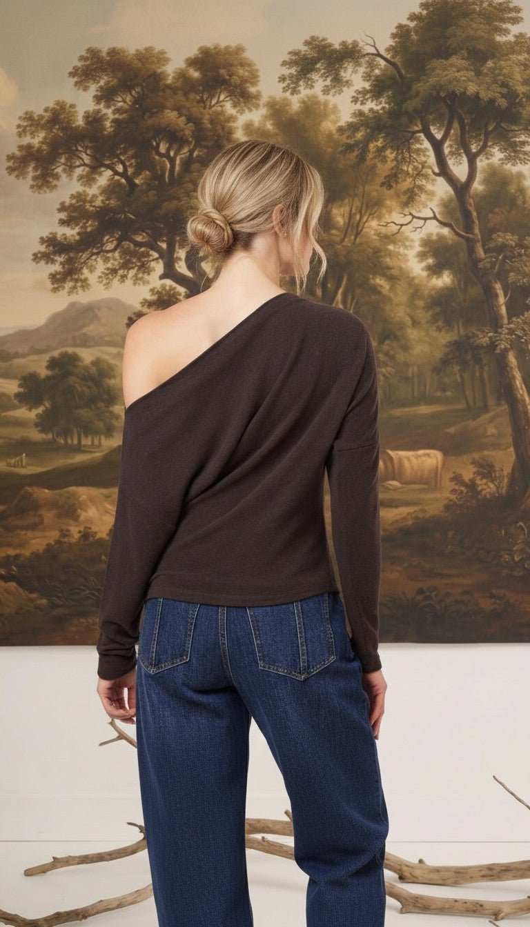 graced chocolate brown off-the-shoulder top with long sleeves worn by a woman with blonde hair in a bun