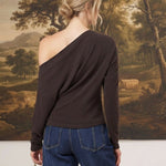 graced chocolate brown off-the-shoulder top with long sleeves worn by a woman with blonde hair in a bun