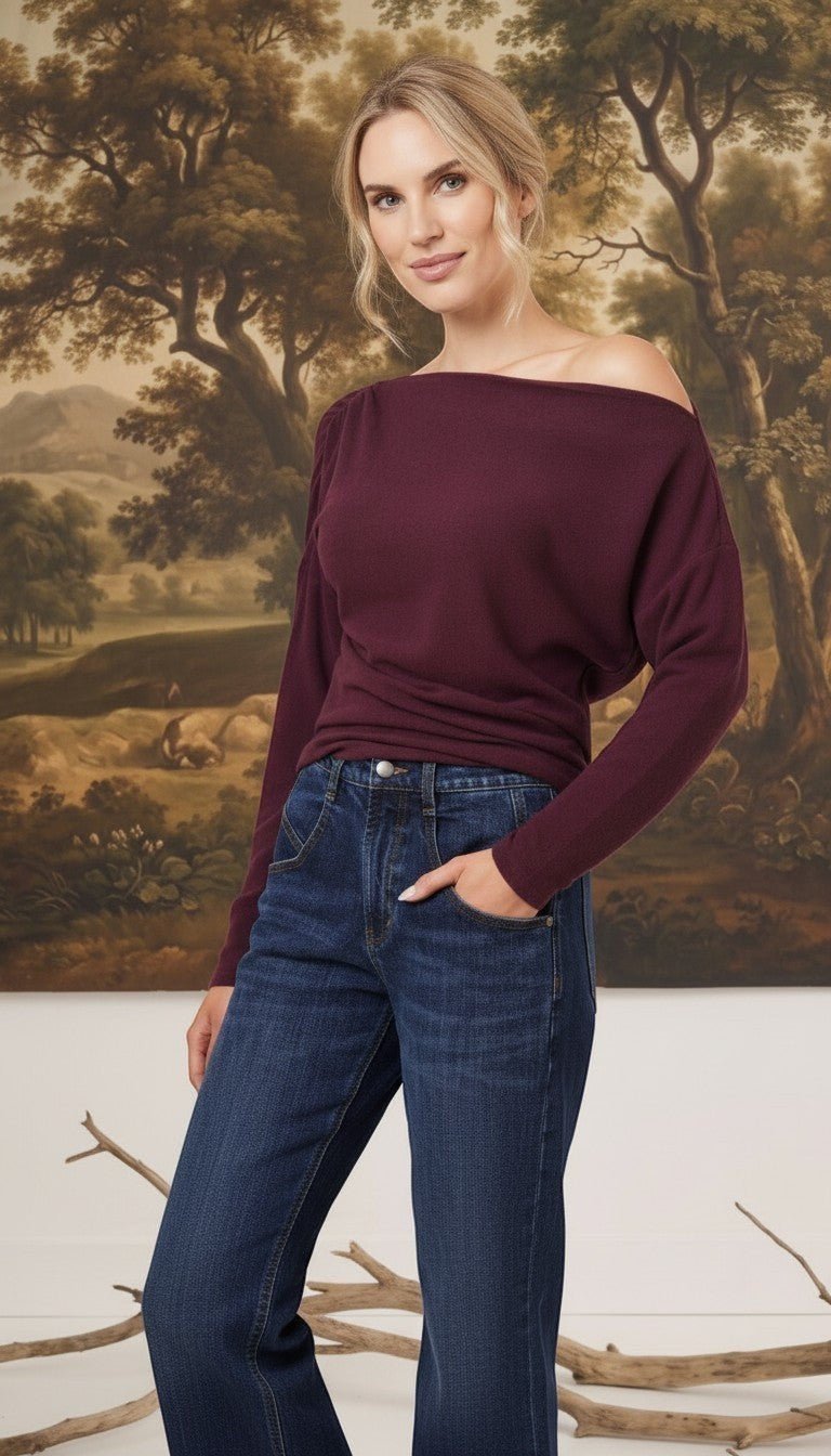 graced winetasting off the shoulder top with long sleeves worn by a blonde model with dark blue jeans