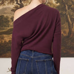 graced winetasting off the shoulder top with long sleeves worn by a woman with blonde hair in a bun