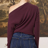 graced winetasting off the shoulder top with long sleeves worn by a woman with blonde hair in a bun