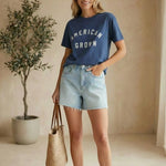 Blue cotton Rosa American Tee by Z Supply, a casual basic top with a relaxed fit and soft fabric, displayed on a hanger.