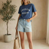 Blue cotton Rosa American Tee by Z Supply, a casual basic top with a relaxed fit and soft fabric, displayed on a hanger.