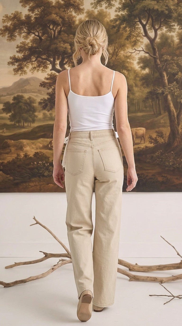 graced white fitted cami with spaghetti straps worn with beige denim jeans, viewed from the back