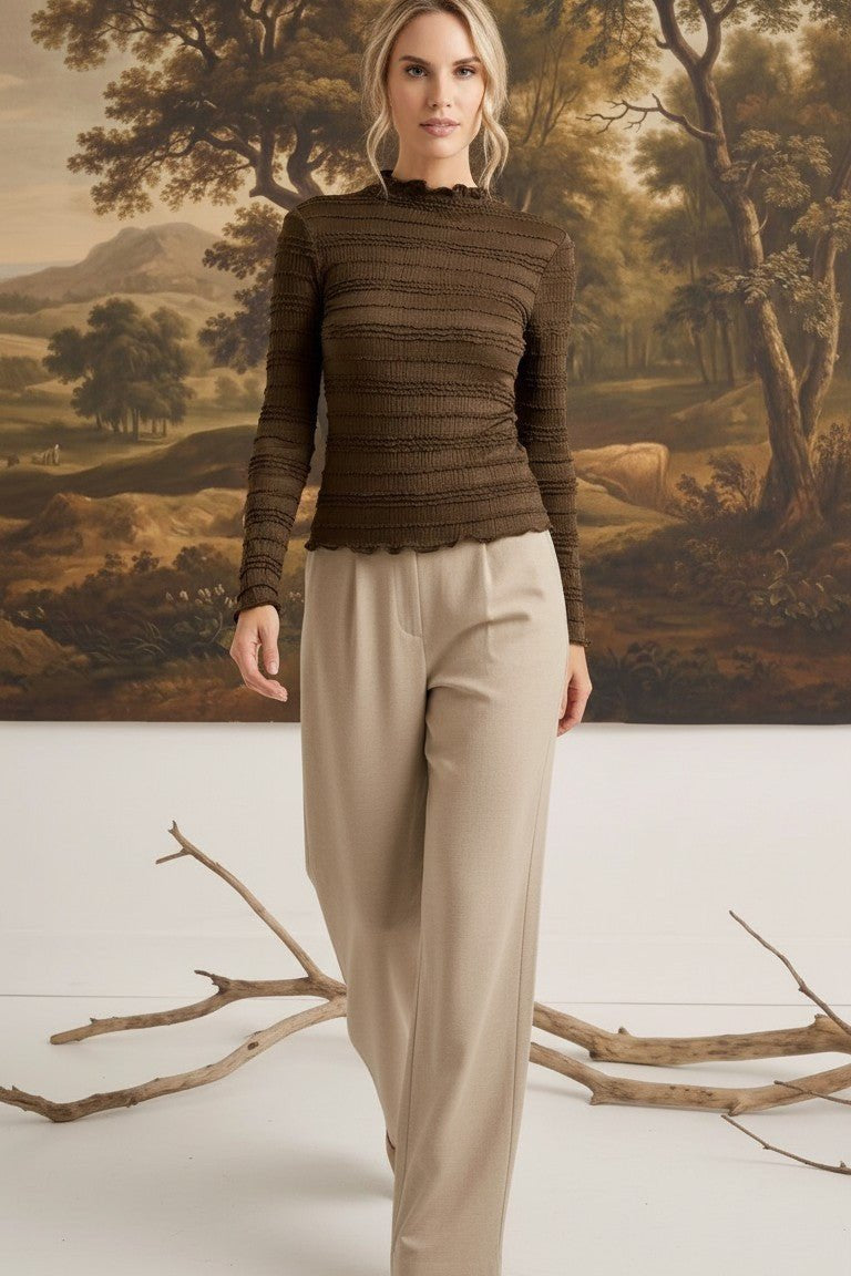 graced Tatum chocolate brown long-sleeve top with lettuce-edge neckline and sleeves worn by a blonde model