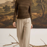 graced Tatum chocolate brown long-sleeve top with lettuce-edge neckline and sleeves worn by a blonde model