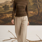 graced Tatum chocolate brown long-sleeve top with lettuce-edge neckline and sleeves worn by a blonde model