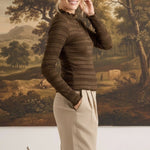 A model wearing the graced Tatum Lettuce Edge Top in chocolate brown with textured fabric and delicate trim details.