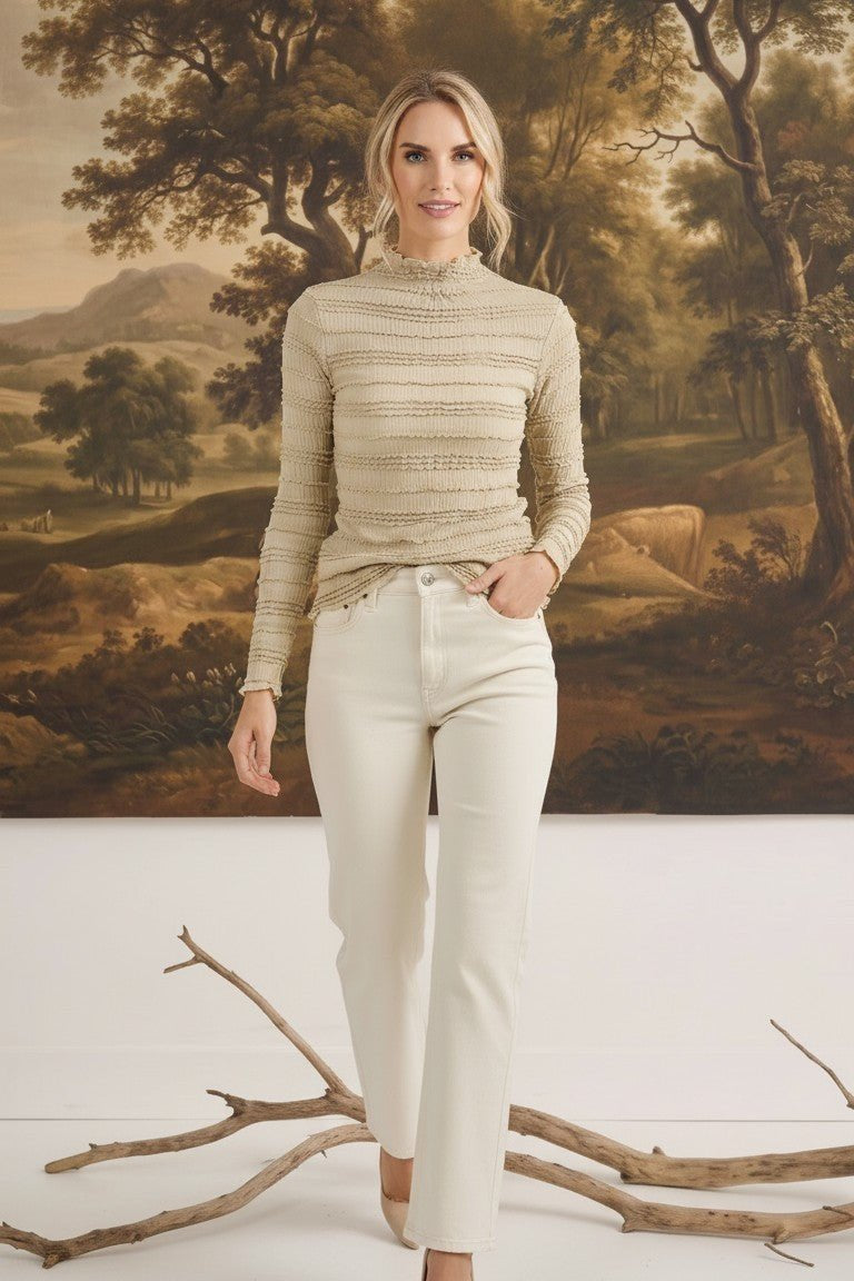 Model wearing graced The Tatum Lettuce Edge Top in oatmeal with textured fabric and feminine lettuce-edge detailing.