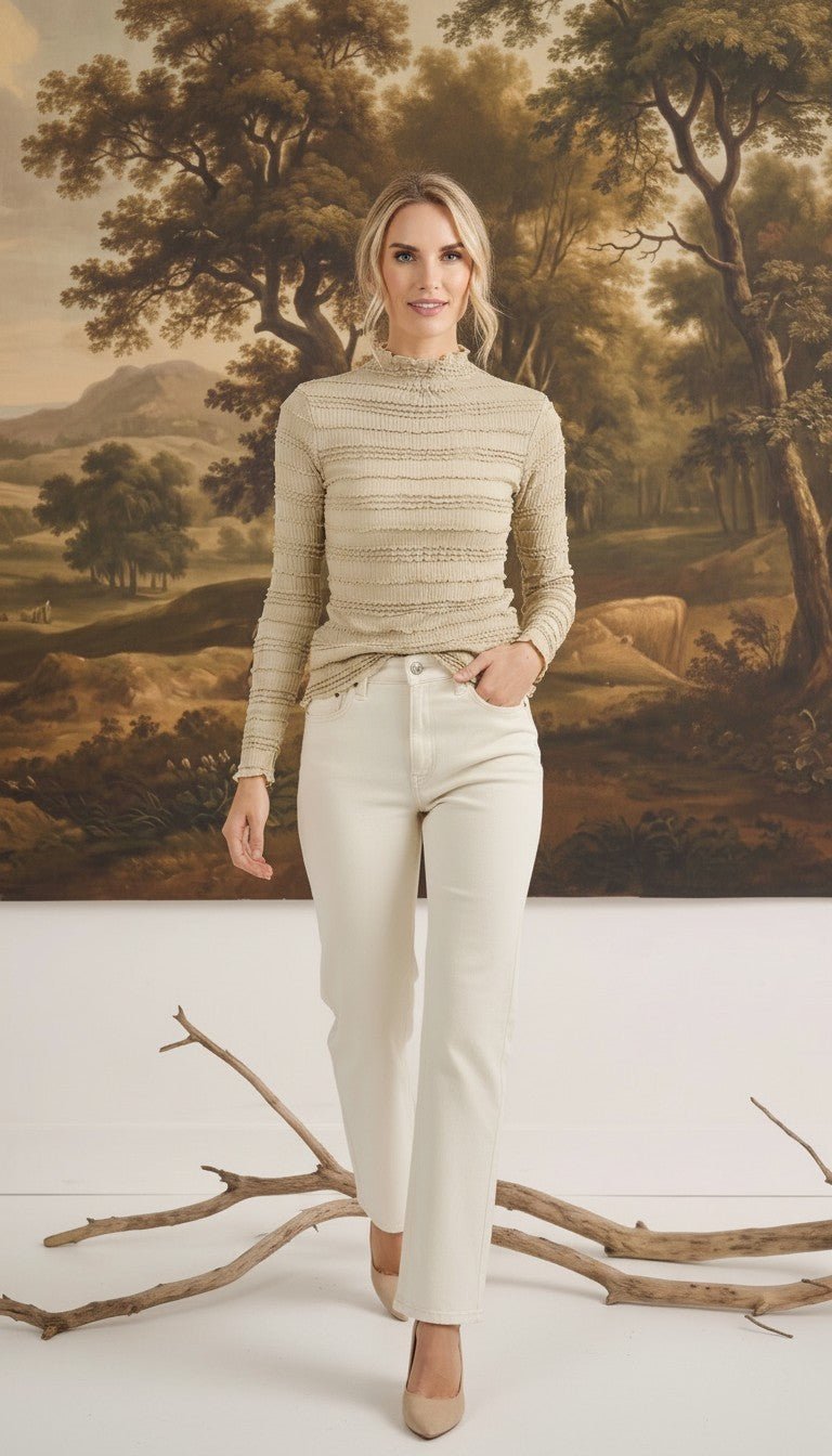 Model wearing graced The Tatum Lettuce Edge Top in oatmeal with textured fabric and feminine lettuce-edge detailing.