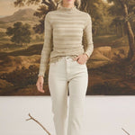 Model wearing graced The Tatum Lettuce Edge Top in oatmeal with textured fabric and feminine lettuce-edge detailing.