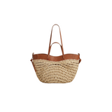 Tan woven raffia and leather tote bag by Urban Daizy, stylish accessory with spacious interior and natural texture.